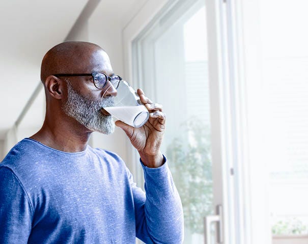 Man drinking a glass of milk